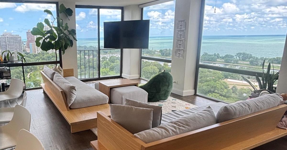 Bright lakefront living room with clear surfaces and a lake view