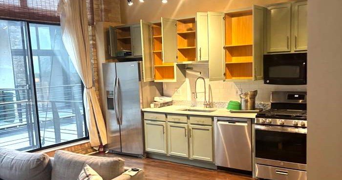 Loft kitchen after work finished, cabinets emptied and wiped inside